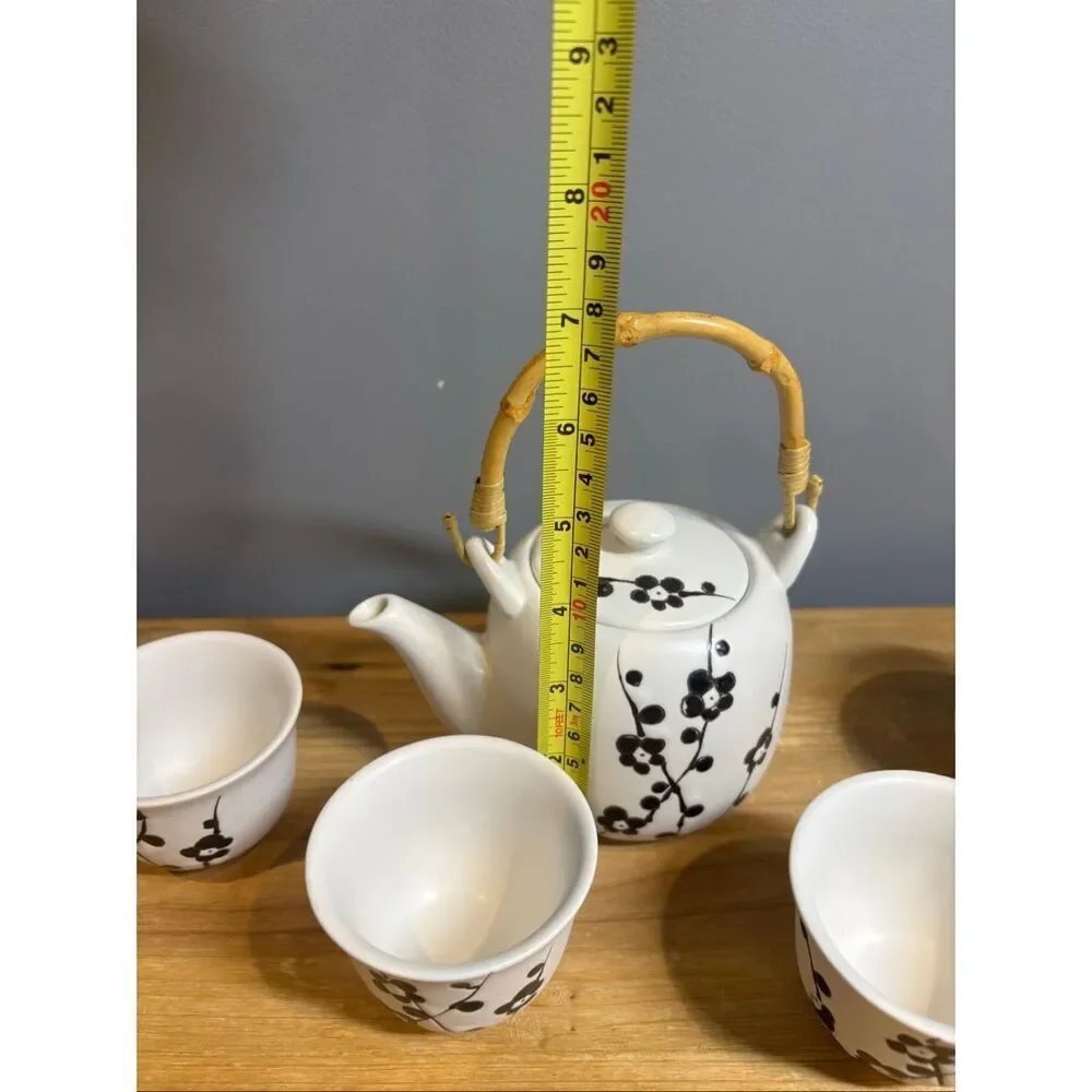 White ceramic tea pot and 4 tea cups with black cherry blossoms